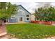 Spacious backyard featuring a lush lawn and privacy fence at 10364 Ravenswood Way, Highlands Ranch, CO 80130