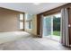 Dining room with sliding glass doors to the backyard and an adjacent sitting area at 10364 Ravenswood Way, Highlands Ranch, CO 80130