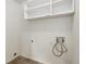Laundry room with white walls, tile flooring, and shelving at 10364 Ravenswood Way, Highlands Ranch, CO 80130