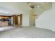 Spacious living area with stairs, view of front door, and access to kitchen at 10364 Ravenswood Way, Highlands Ranch, CO 80130
