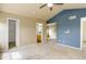 Main bedroom with carpet, ensuite bathroom and walk in closet at 10364 Ravenswood Way, Highlands Ranch, CO 80130