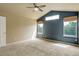 Large primary bedroom with vaulted ceilings, carpet floors, and large windows at 10364 Ravenswood Way, Highlands Ranch, CO 80130
