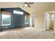 Spacious primary bedroom with vaulted ceiling, carpet and multiple windows at 10364 Ravenswood Way, Highlands Ranch, CO 80130