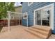 Patio area with pergola and pavers, steps to the yard, great for outdoor entertaining at 10364 Ravenswood Way, Highlands Ranch, CO 80130