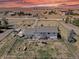 Aerial view of the house showcasing fenced yard and outbuildings at 43400 Somerset Ct, Elizabeth, CO 80107