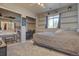 Bedroom featuring built-in shelves, natural light, and carpet flooring at 43400 Somerset Ct, Elizabeth, CO 80107