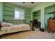 Bedroom with a floral comforter, large window, and adjacent closet space at 43400 Somerset Ct, Elizabeth, CO 80107