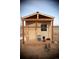 Newly constructed chicken coop with a green roof, outdoor run and feeder at 43400 Somerset Ct, Elizabeth, CO 80107