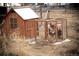 Chicken coop featuring an attached run, providing a safe and spacious outdoor environment at 43400 Somerset Ct, Elizabeth, CO 80107