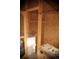 Interior view of a chicken coop featuring roosting bars and nesting boxes at 43400 Somerset Ct, Elizabeth, CO 80107