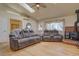 Inviting living room with comfortable seating, a fireplace, and bright natural light at 43400 Somerset Ct, Elizabeth, CO 80107