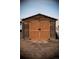 Wooden shed with double doors at 43400 Somerset Ct, Elizabeth, CO 80107