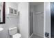 Clean and modern bathroom featuring a shower stall, tile floor, and ample cabinet storage at 837 E 17Th Avenue # 2K, Denver, CO 80218