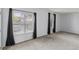Well-lit bedroom with large windows, neutral walls, and plush carpeting at 837 E 17Th Avenue # 2K, Denver, CO 80218