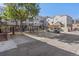 Back view of complex showing the parking area, a gazebo and outdoor dining or lounging at 837 E 17Th Avenue # 2K, Denver, CO 80218