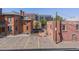 Brick building with reserved parking, set amongst a mix of modern and historic buildings in an urban setting at 837 E 17Th Avenue # 2K, Denver, CO 80218