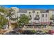 Charming multi-story building with brick accents, balconies, and street-front retail space, perfect for urban living at 837 E 17Th Avenue # 2K, Denver, CO 80218