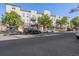 Multi-story building featuring a mix of retail shops and residential apartments, each with private balconies at 837 E 17Th Avenue # 2K, Denver, CO 80218