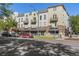 Multi-story building featuring a mix of retail shops and residential apartments, each with private balconies at 837 E 17Th Avenue # 2K, Denver, CO 80218