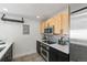 Modern kitchen with stainless steel appliances, sleek countertops, and ample storage space at 837 E 17Th Avenue # 2K, Denver, CO 80218