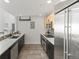 Modern kitchen with stainless steel appliances, sleek countertops, and ample storage space at 837 E 17Th Avenue # 2K, Denver, CO 80218