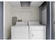 Functional laundry room with washer, dryer, and storage space for convenience at 837 E 17Th Avenue # 2K, Denver, CO 80218