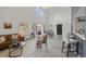 Spacious living area with large windows, comfortable seating, and dining space at 837 E 17Th Avenue # 2K, Denver, CO 80218