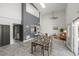 Spacious living area with high ceilings, modern decor, and a seamless flow to the dining and kitchen areas at 837 E 17Th Avenue # 2K, Denver, CO 80218