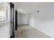 Bright, carpeted living room with black curtains and large windows at 837 E 17Th Avenue # 2K, Denver, CO 80218
