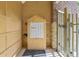 Secure mailboxes in a sheltered entrance with brick accents and ample lighting at 837 E 17Th Avenue # 2K, Denver, CO 80218