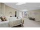 Large main bedroom with carpeted floors, skylight, sitting area, and ensuite bathroom at 837 E 17Th Avenue # 2K, Denver, CO 80218