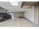 A well-lit parking garage with numbered parking spaces and a dark gray SUV parked in space #57 at 837 E 17Th Avenue # 2K, Denver, CO 80218
