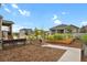 Landscaped backyard with raised garden beds and walkway at 2614 Hillcroft Ln, Castle Rock, CO 80104