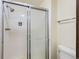 Full bathroom features a fully tiled shower, toilet, and towel bar at 8155 Everett E St, Arvada, CO 80005