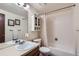 Standard bathroom featuring a shower-tub combination, vanity with sink, and cabinet for additional storage at 8155 Everett E St, Arvada, CO 80005
