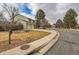 Attractive two-story home with a well-maintained lawn and two car garage on a cloudy day at 8155 Everett E St, Arvada, CO 80005