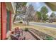 Inviting front porch with comfortable seating and a view of the landscaped front yard and street at 8155 Everett E St, Arvada, CO 80005