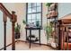 Bright hallway nook with large window, featuring plants for natural light and a decorative touch at 8155 Everett E St, Arvada, CO 80005