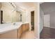 Clean bathroom with double sinks and a shower/tub combo at 17624 E Peakview Ave, Aurora, CO 80016