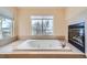 Relaxing bathroom with a jetted tub and fireplace at 17624 E Peakview Ave, Aurora, CO 80016