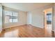 Simple bedroom with hardwood floors and window at 17624 E Peakview Ave, Aurora, CO 80016