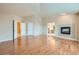 Bright bedroom featuring hardwood floors and fireplace at 17624 E Peakview Ave, Aurora, CO 80016