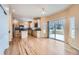 Bright dining area with hardwood floors and sliding doors to deck at 17624 E Peakview Ave, Aurora, CO 80016