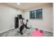 Basement exercise room with stationary bike and weights at 17624 E Peakview Ave, Aurora, CO 80016