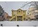 Two-story house exterior with backyard and snowy landscape at 17624 E Peakview Ave, Aurora, CO 80016