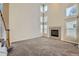 Living room with high ceilings, fireplace and carpet at 17624 E Peakview Ave, Aurora, CO 80016