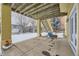 Covered patio with backyard access and snowy view at 17624 E Peakview Ave, Aurora, CO 80016