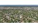 A bird's eye view shows a charming neighborhood with tree-lined streets, various architectural home styles, and nearby city ammenities at 351 Bannock St, Denver, CO 80223