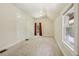 Bedroom with neutral carpet, white walls, window, and trim at 351 Bannock St, Denver, CO 80223