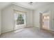 Carpeted bedroom with a window, ceiling fan, and ensuite bathroom at 351 Bannock St, Denver, CO 80223